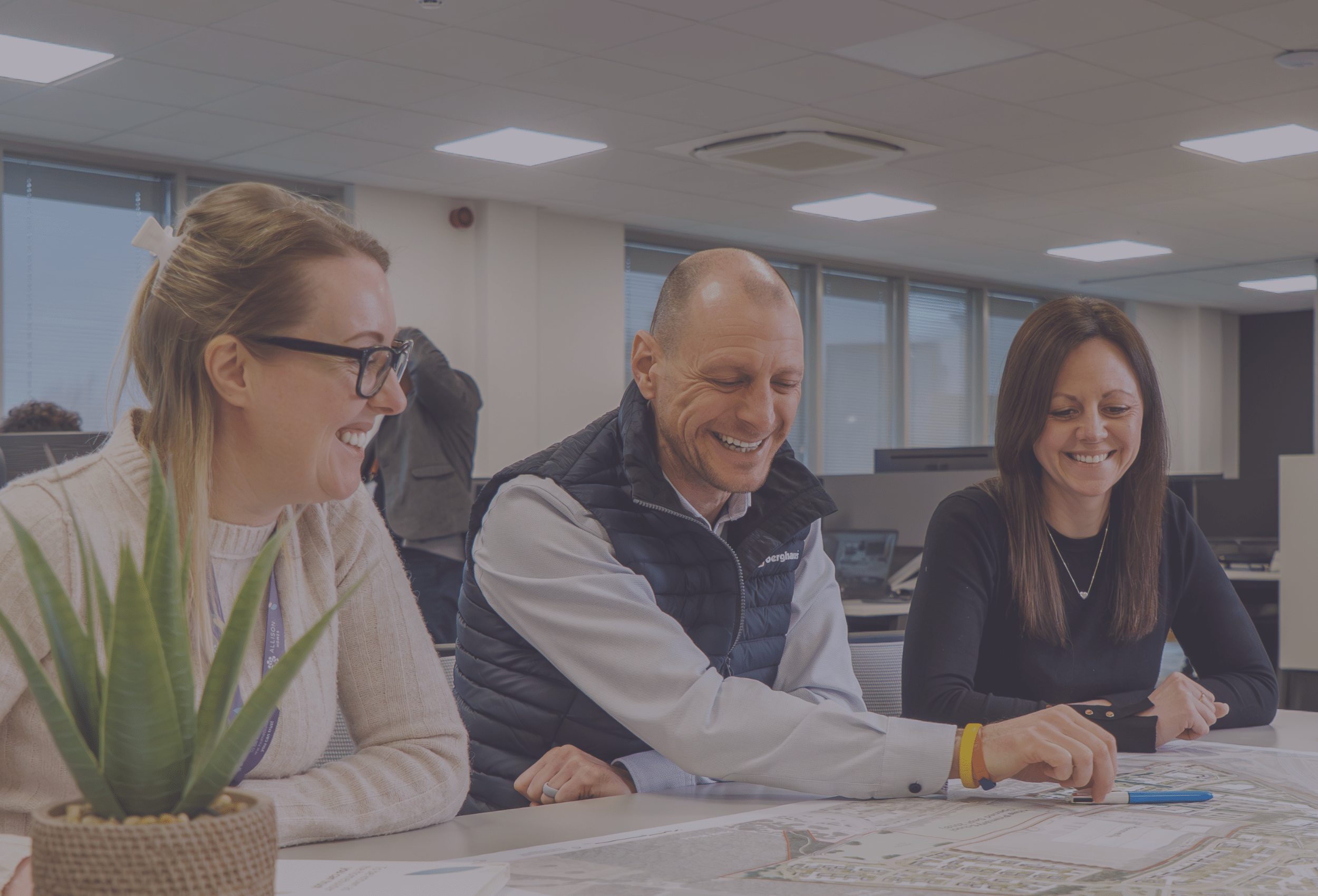 Three smiling co-workers
