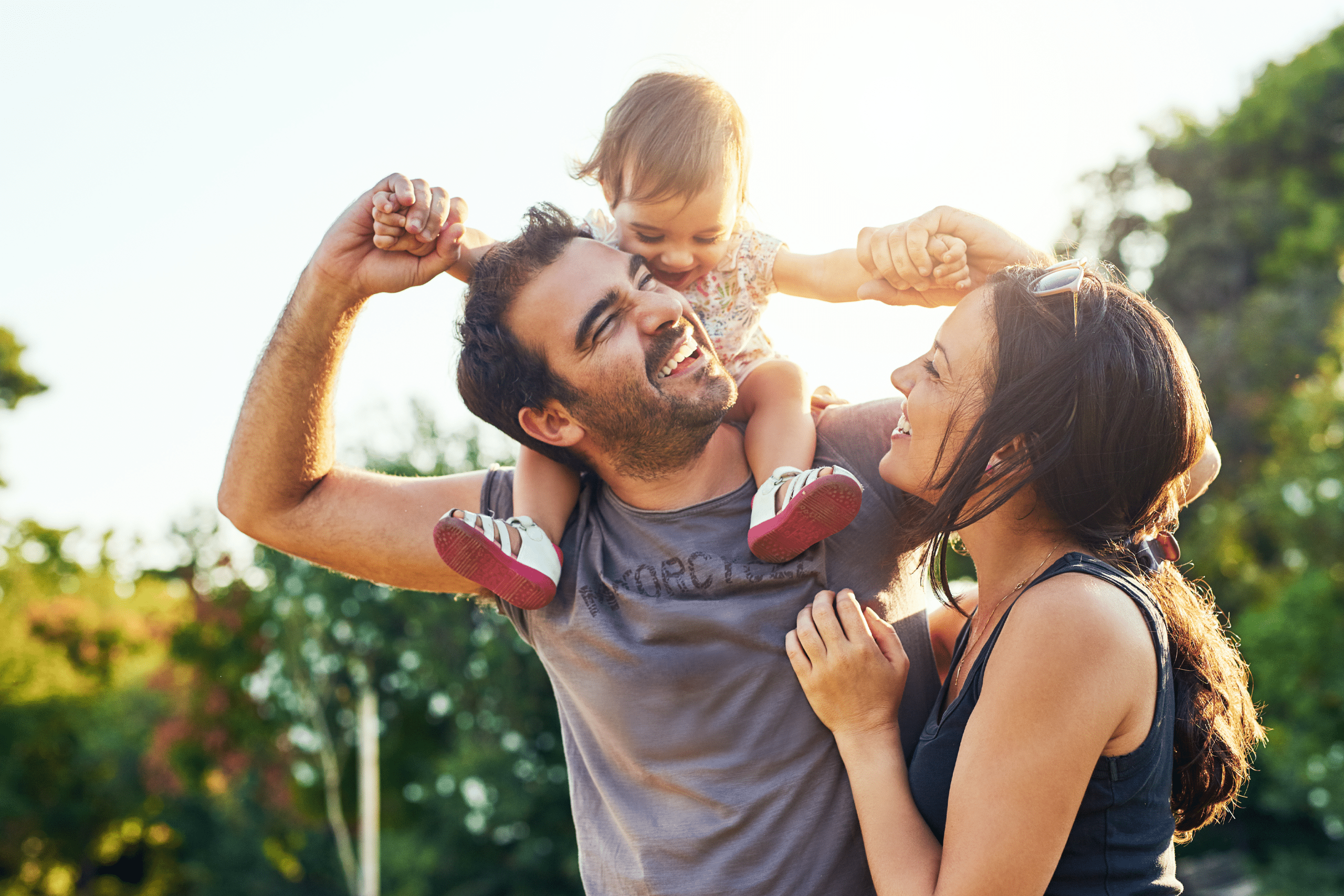 Young Family Playing in the Sun